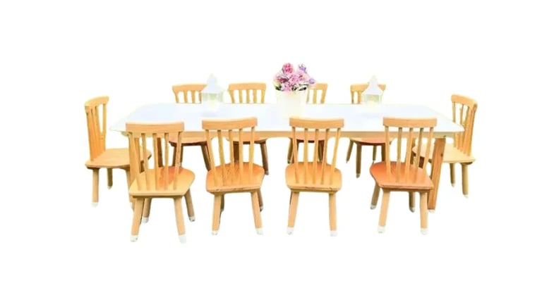 Wooden dining table set with floral centerpiece arrangement