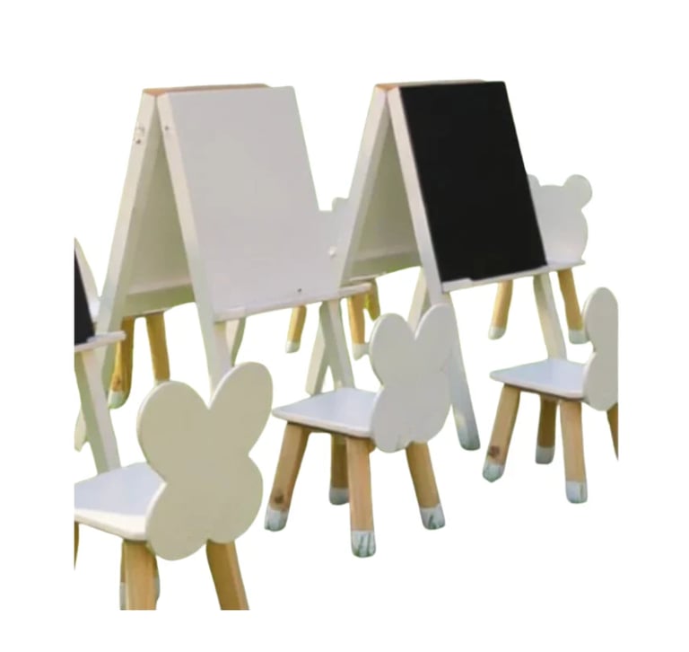Childrens art station with double-sided easels, white chairs shaped like flowers and butterflies, and natural wood legs